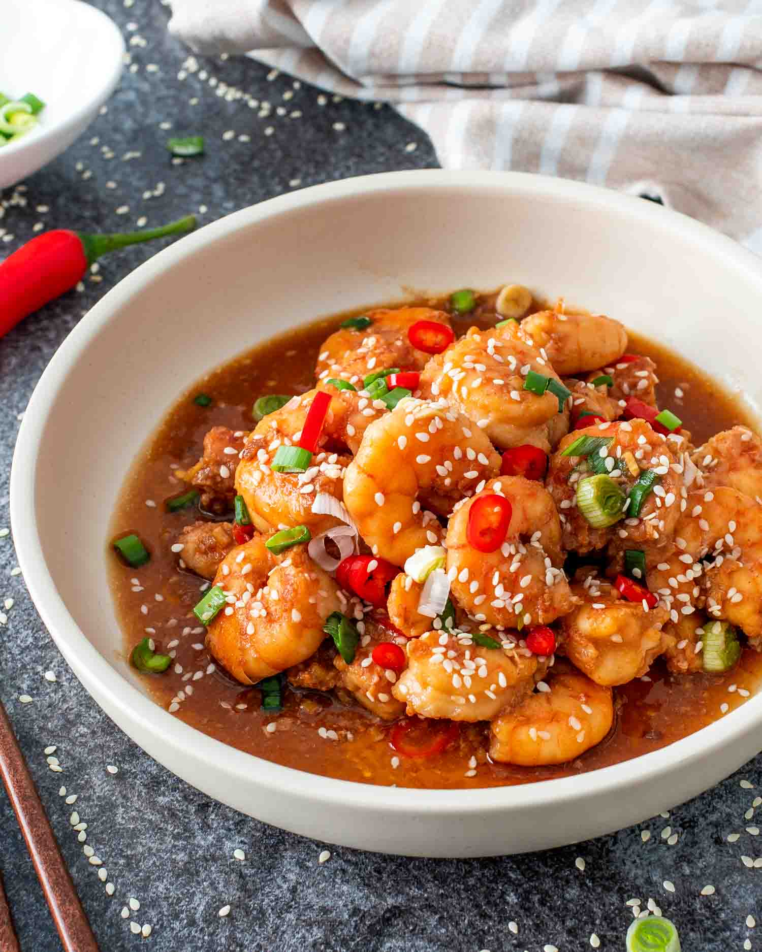 asian garlic shrimp in a white bowl.