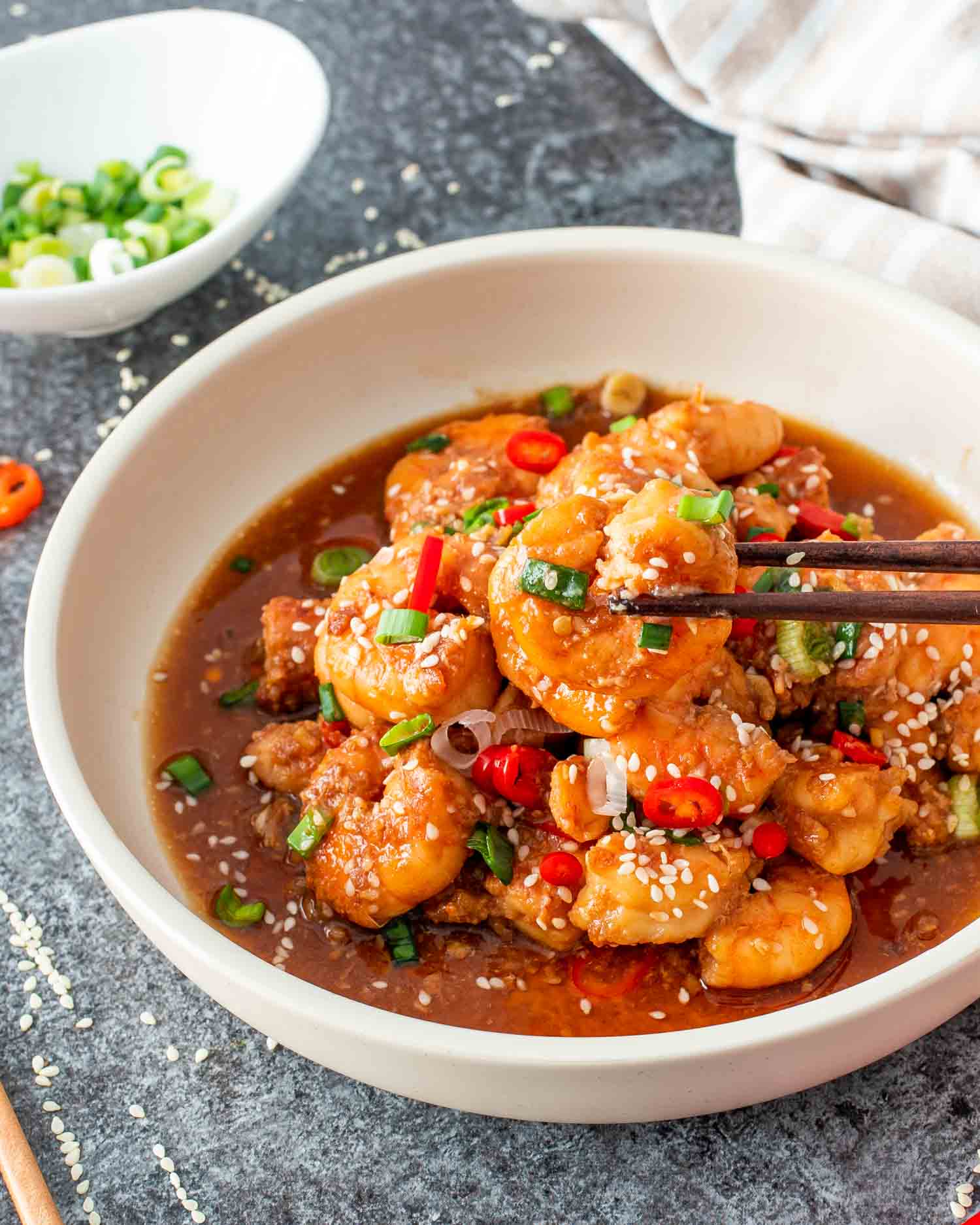 asian garlic shrimp in a white bowl.