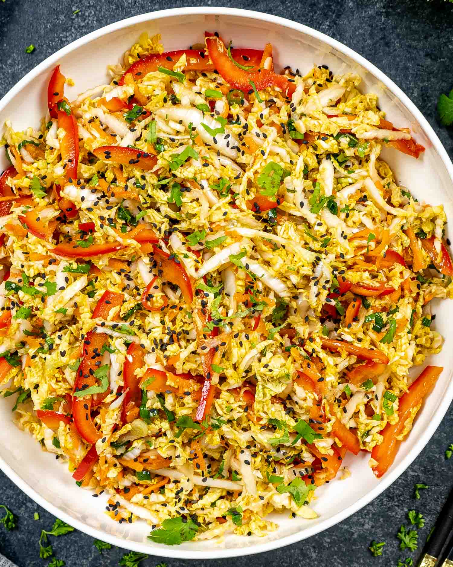 asian style slaw freshly made in a white bowl.