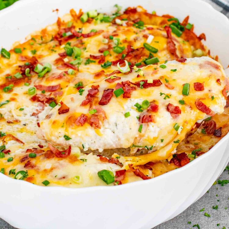 fresh out of the oven baked crack chicken casserole in a white casserole dish.