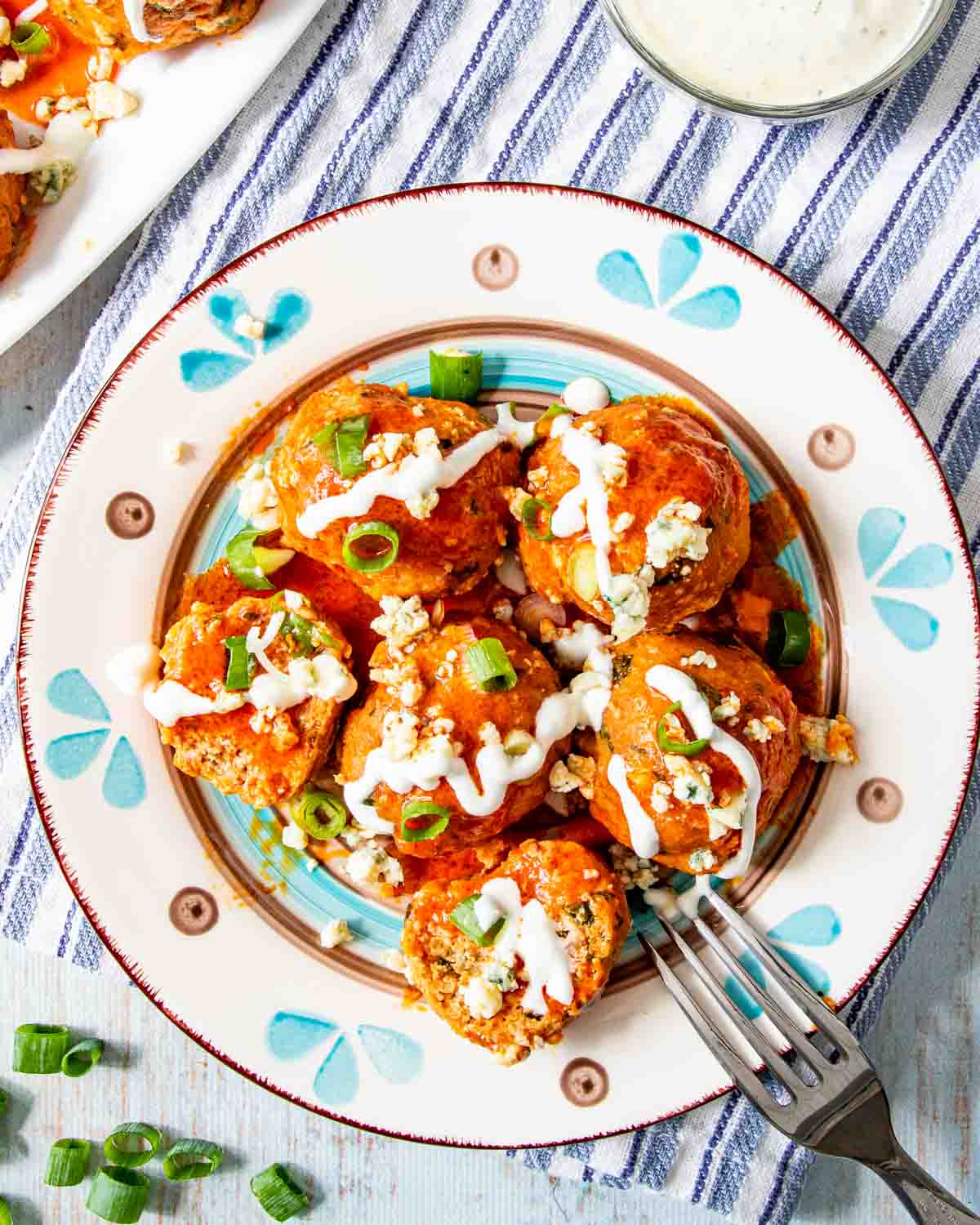buffalo chicken meatballs on a white plate.