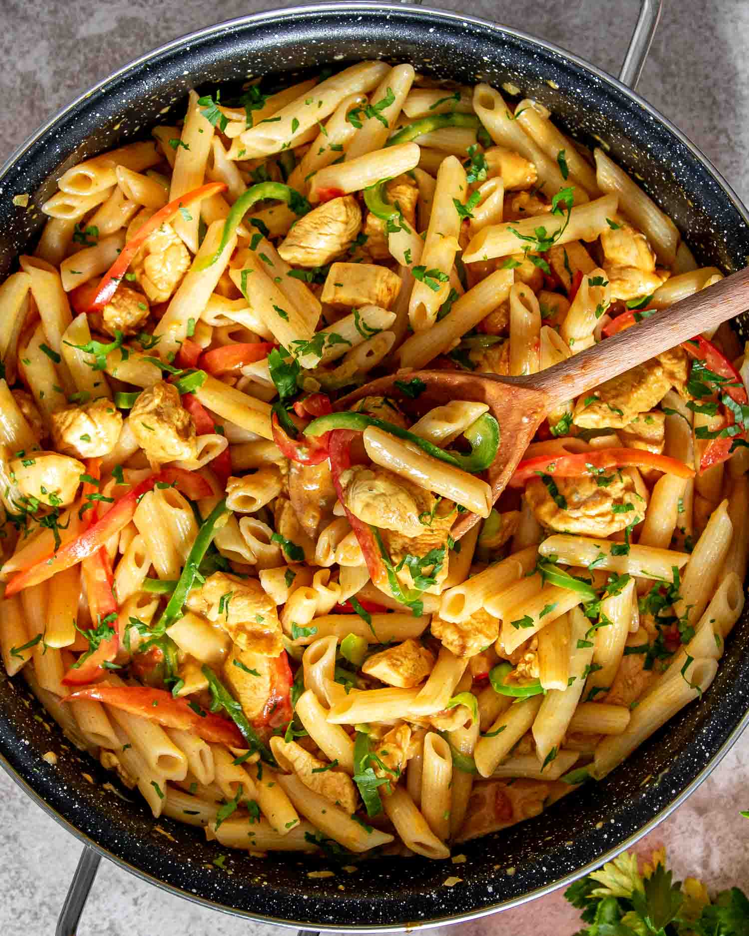 freshly made buffalo chicken pasta in a skillet.