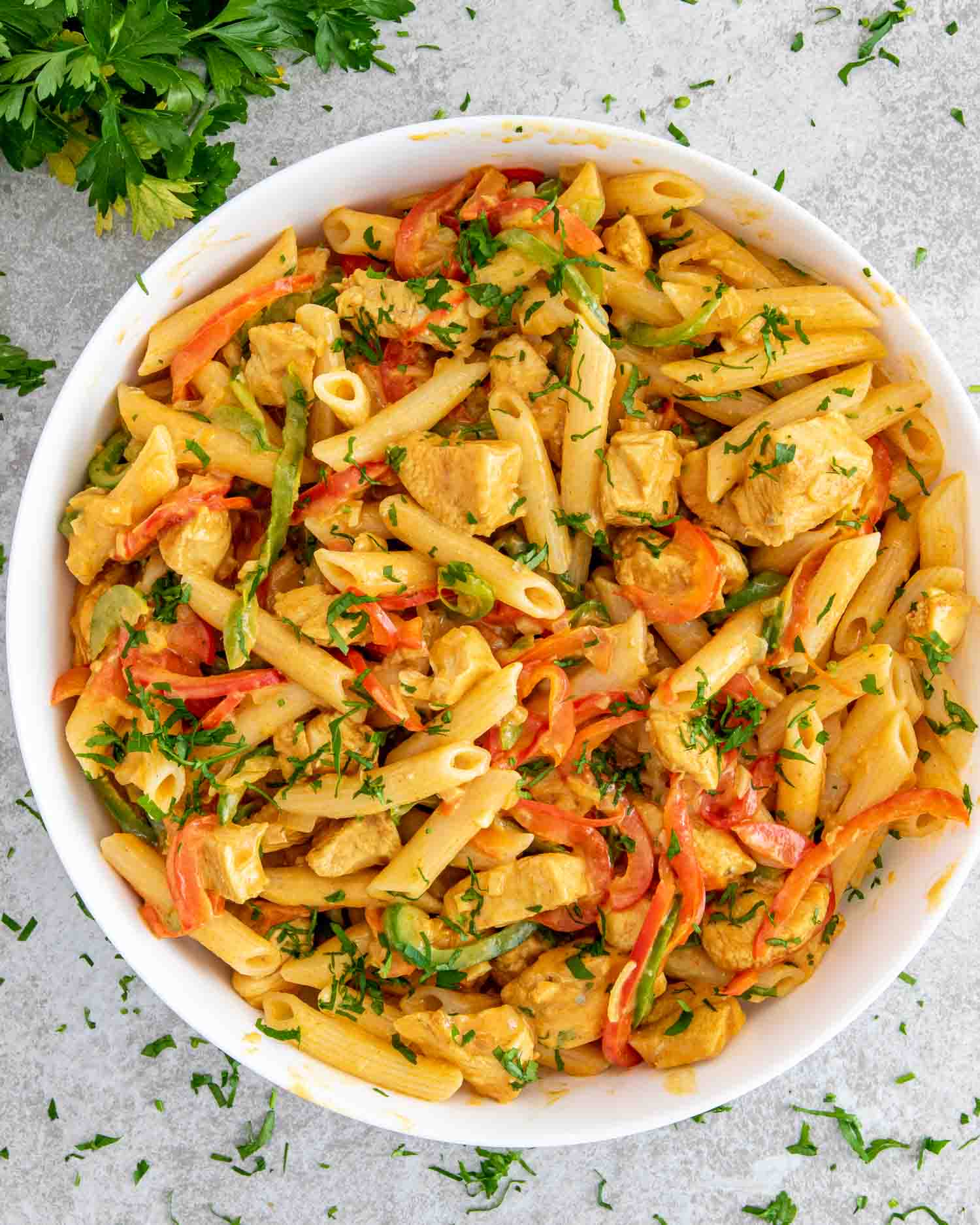 freshly made buffalo chicken pasta in a white bowl.