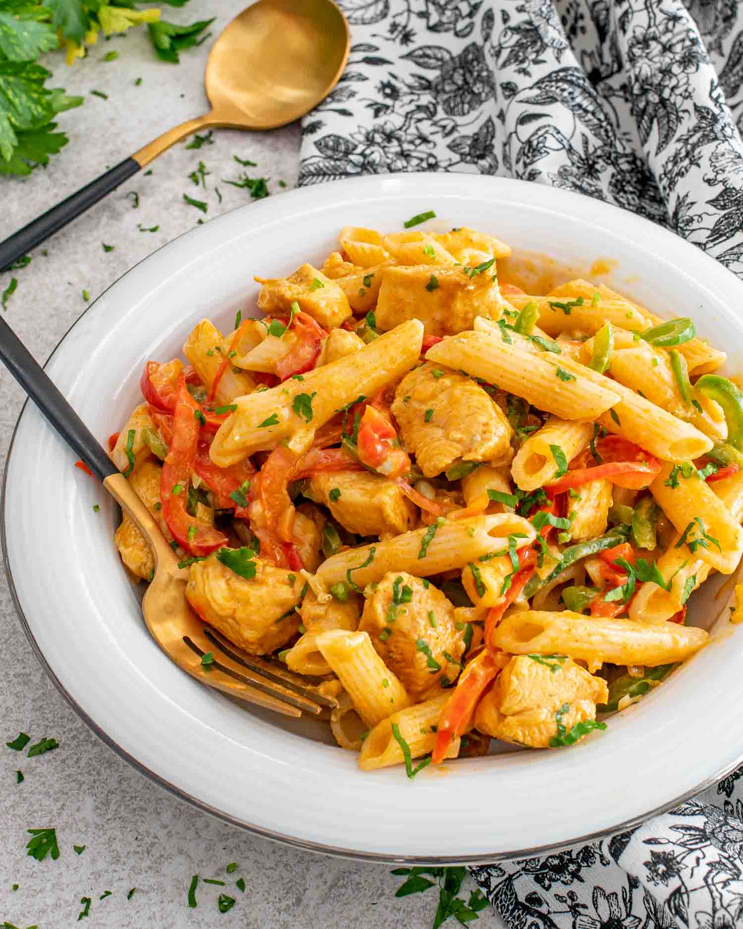 a serving of buffalo chicken pasta in a white plate.