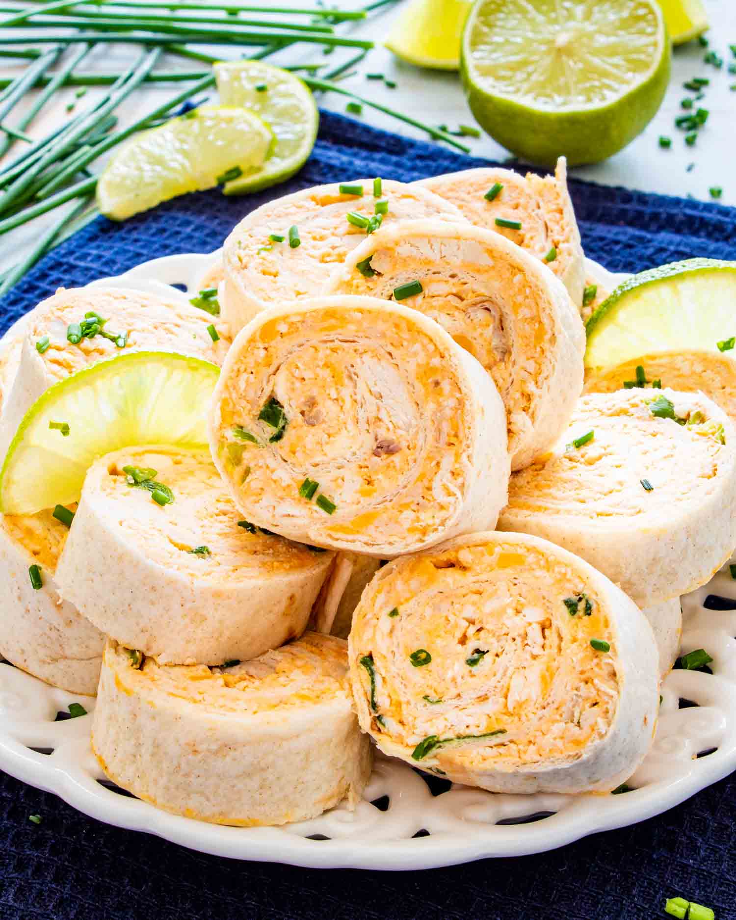 buffalo chicken pinwheels on a white platter.