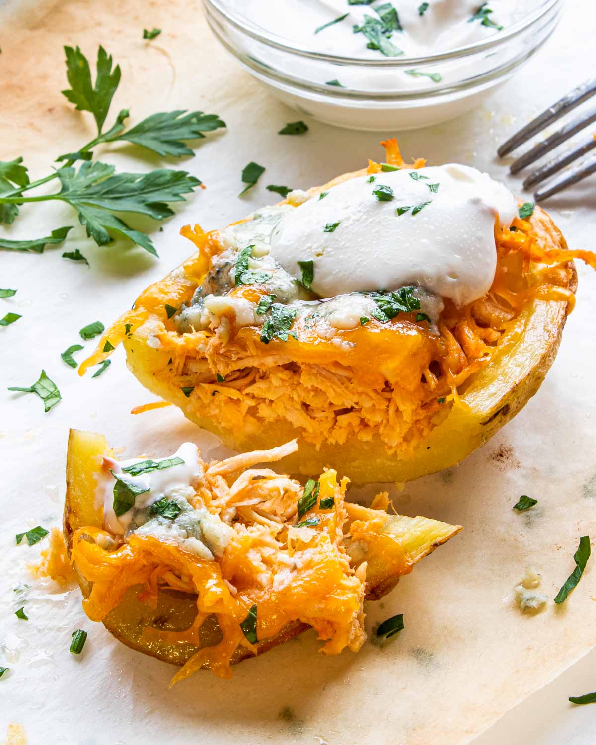 a buffalo chicken potato skins cut in two.