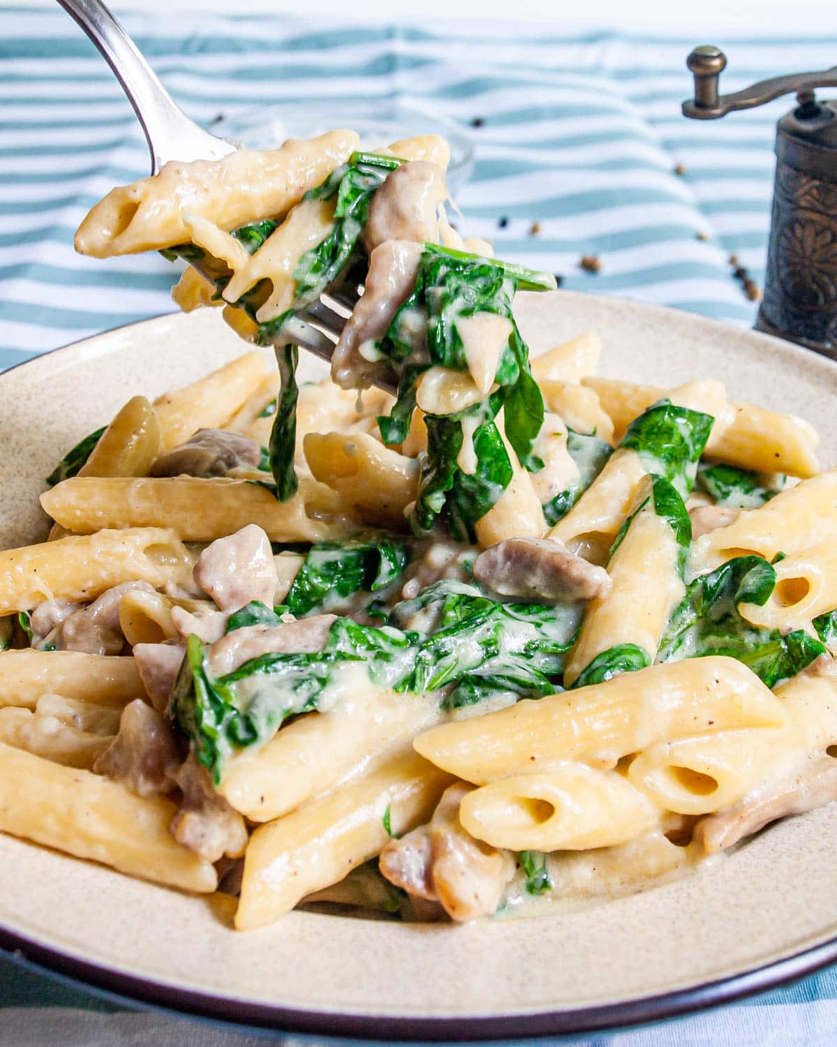 Cheesy Chicken Pasta Cheesy Chicken Pasta on a beige plate