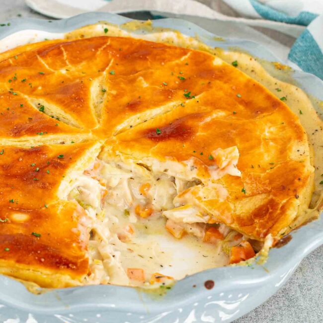 freshly baked chicken and leek pie in a pie dish.