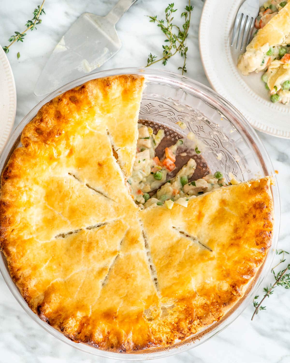 overhead shot of chicken pot pie with two slices taken out of it