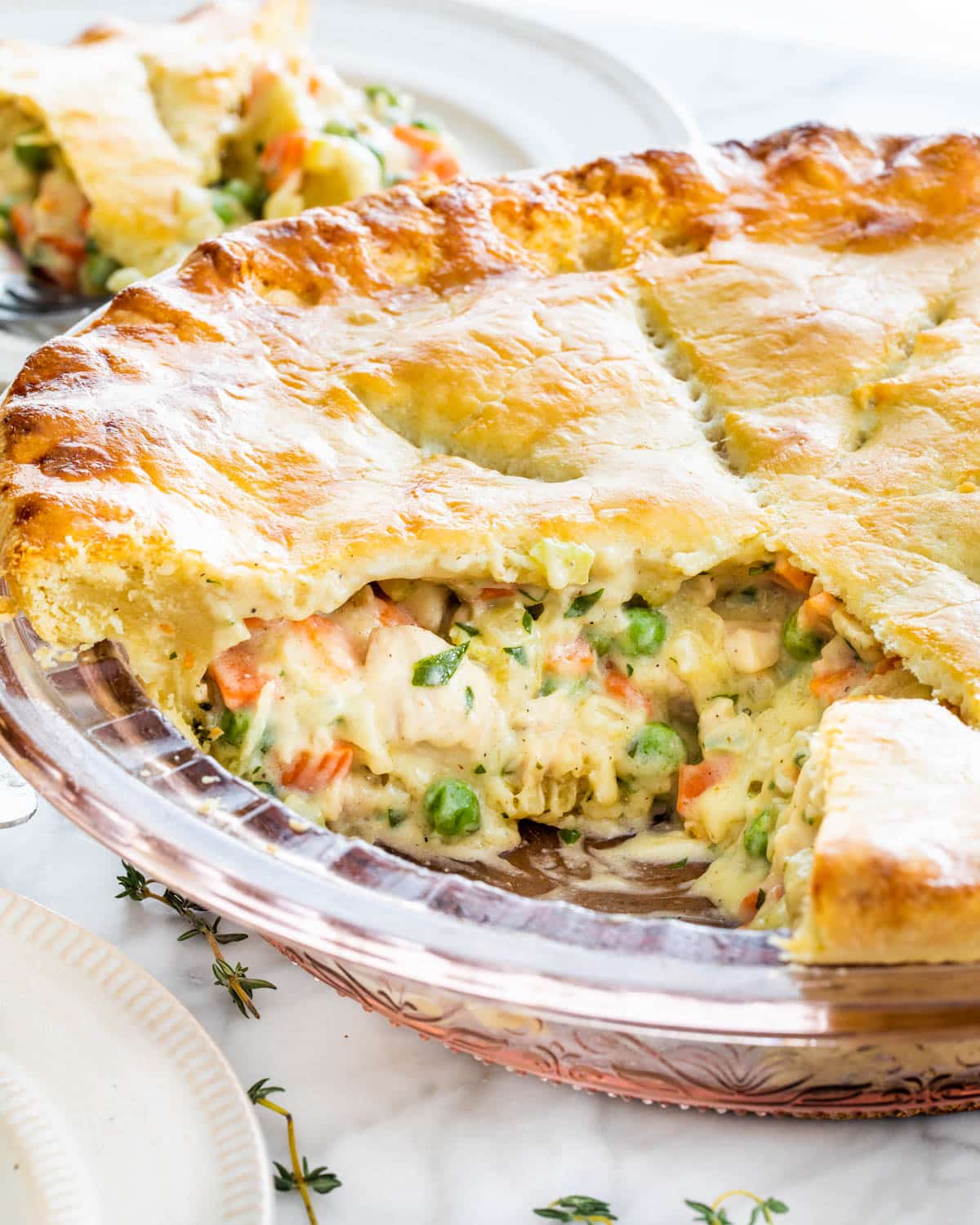 closeup shot of the inside of chicken pot pie in a pie plate