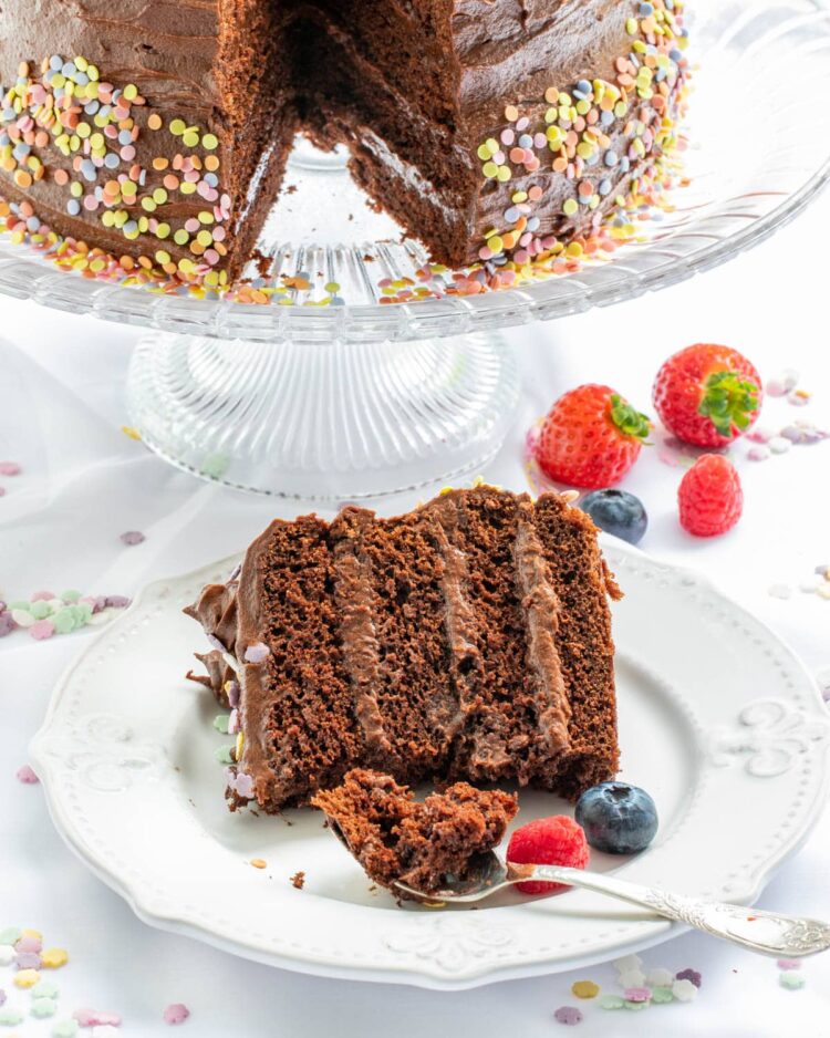 a slice of chocolate cake with a bite taken out of it