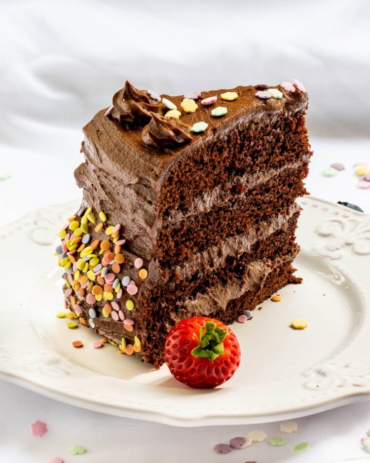 a slice of chocolate cake on a white plate