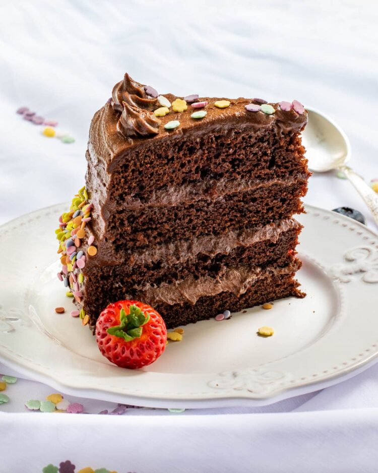 a slice of chocolate cake on a white plate