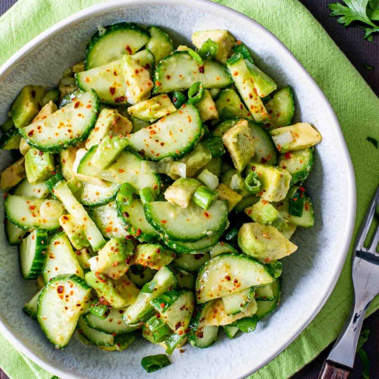 cucumber avocado salad in a bowl.