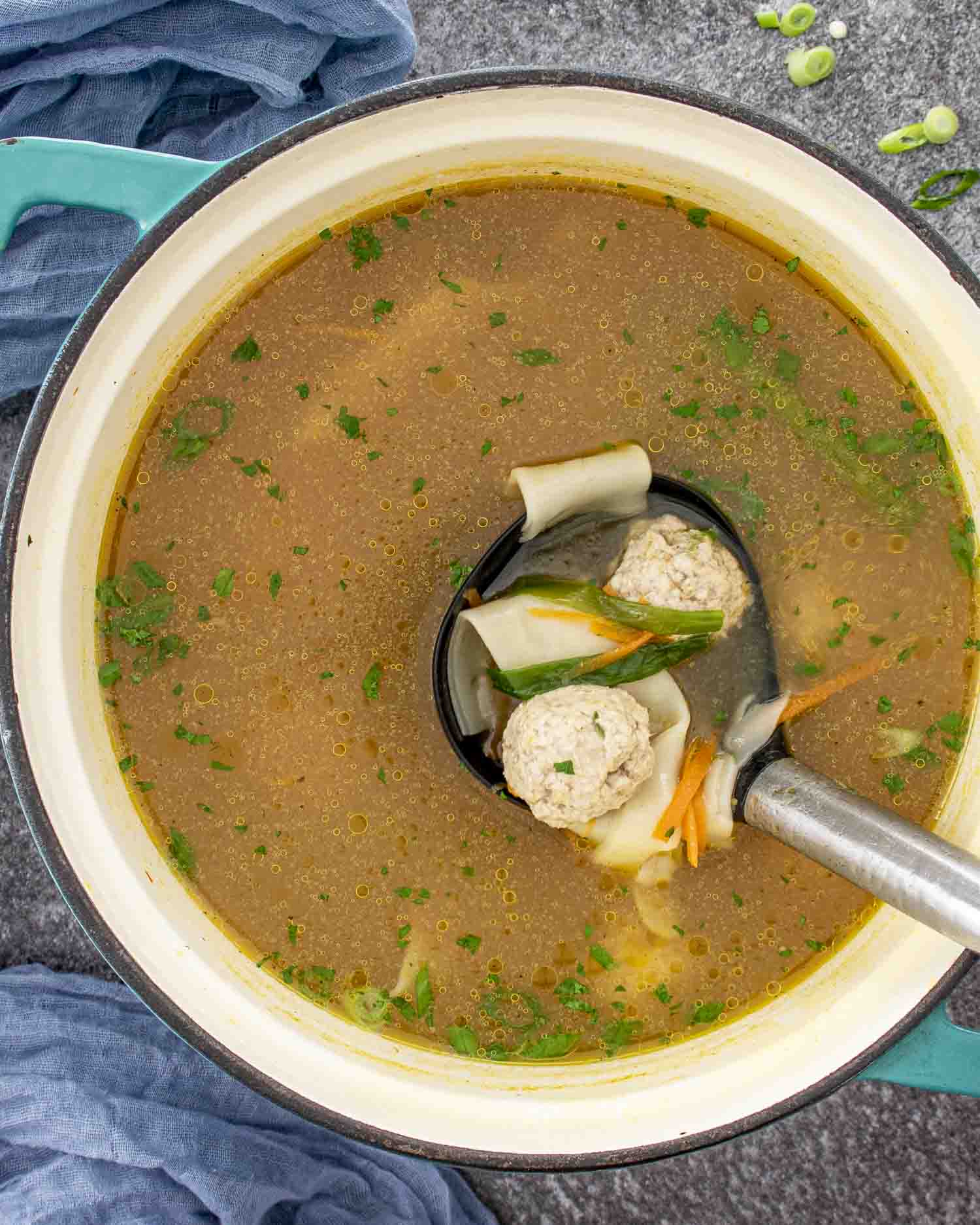 deconstructed wonton soup in a Dutch oven.