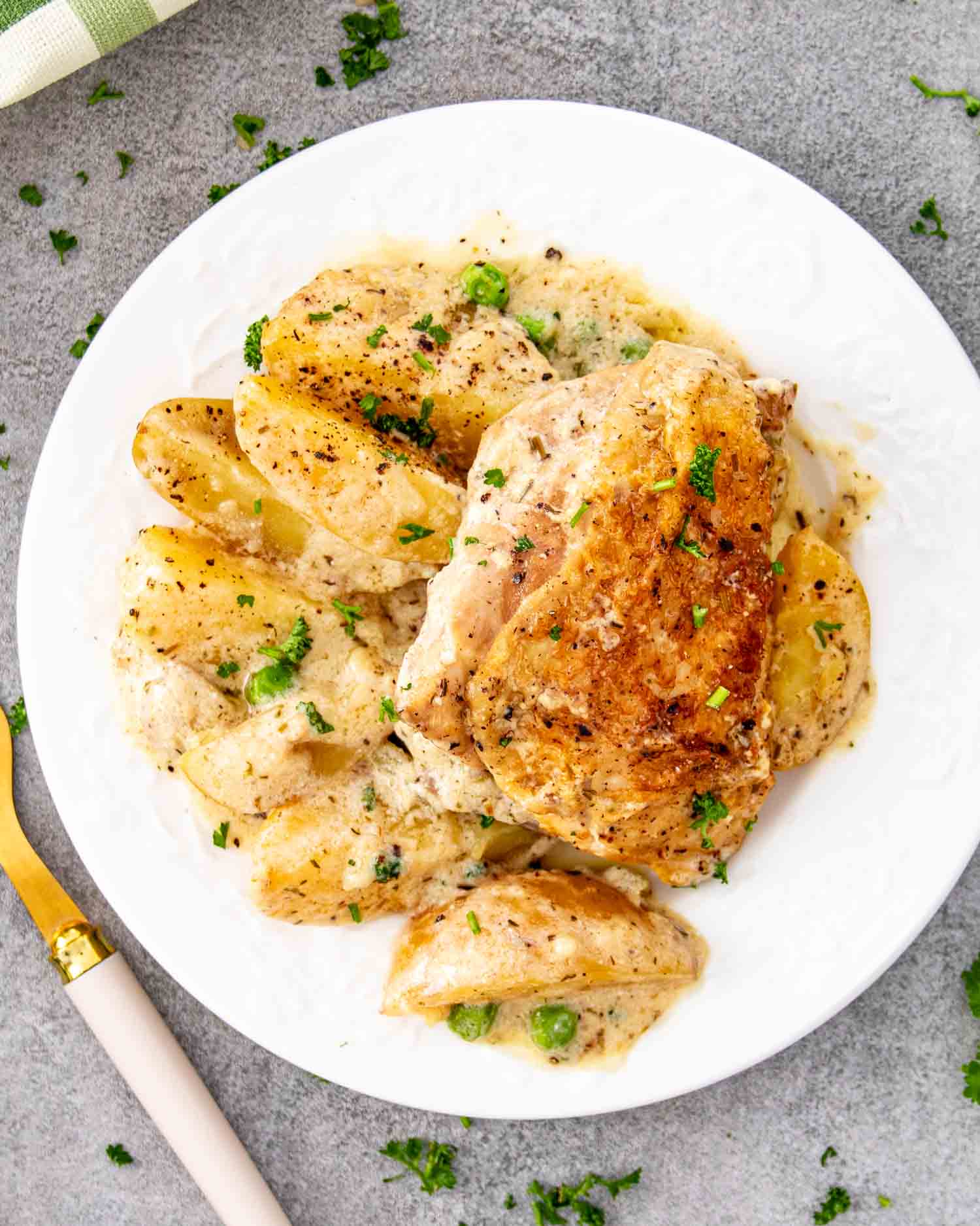 a serving of french chicken casserole in a white plate.