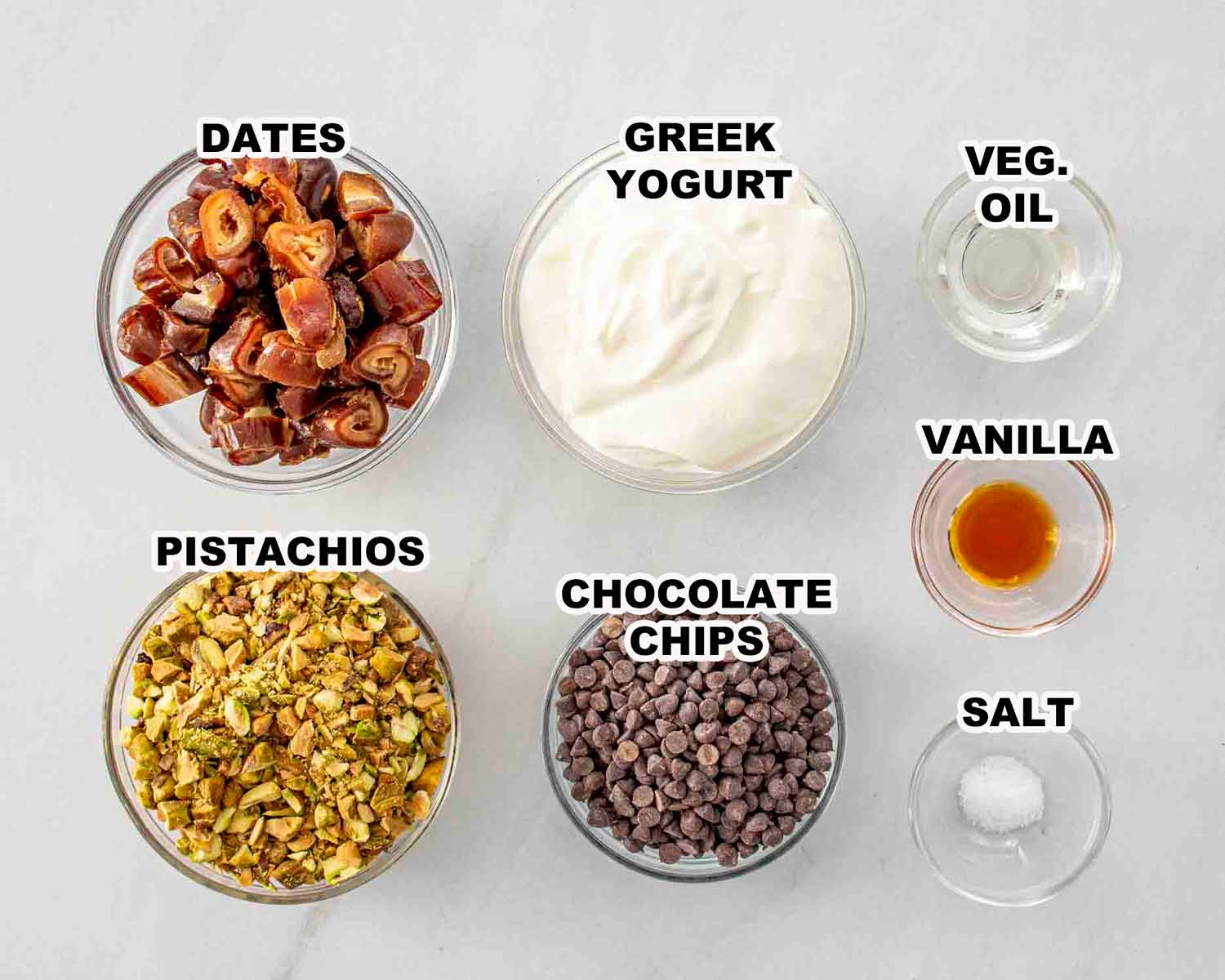 ingredients needed to make frozen pistachio and date chocolate bites.