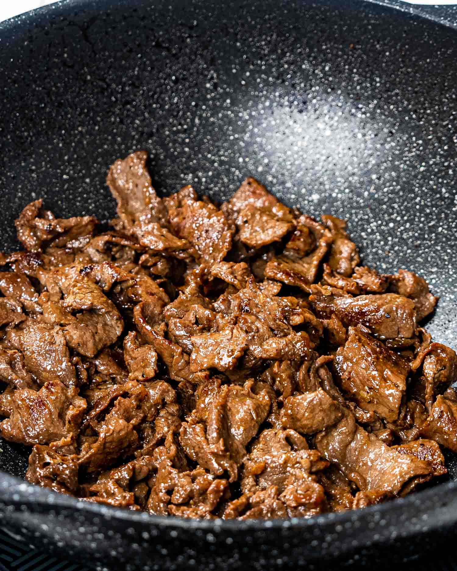 korean beef freshly cooked in a wok.