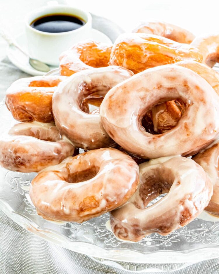 freshly made krispy kreme donuts on a plater