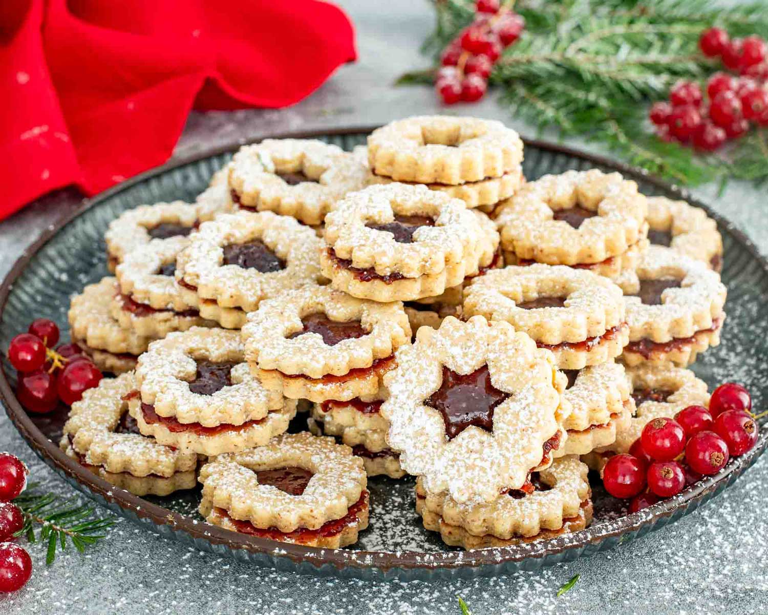 a plate with linzer cookies.