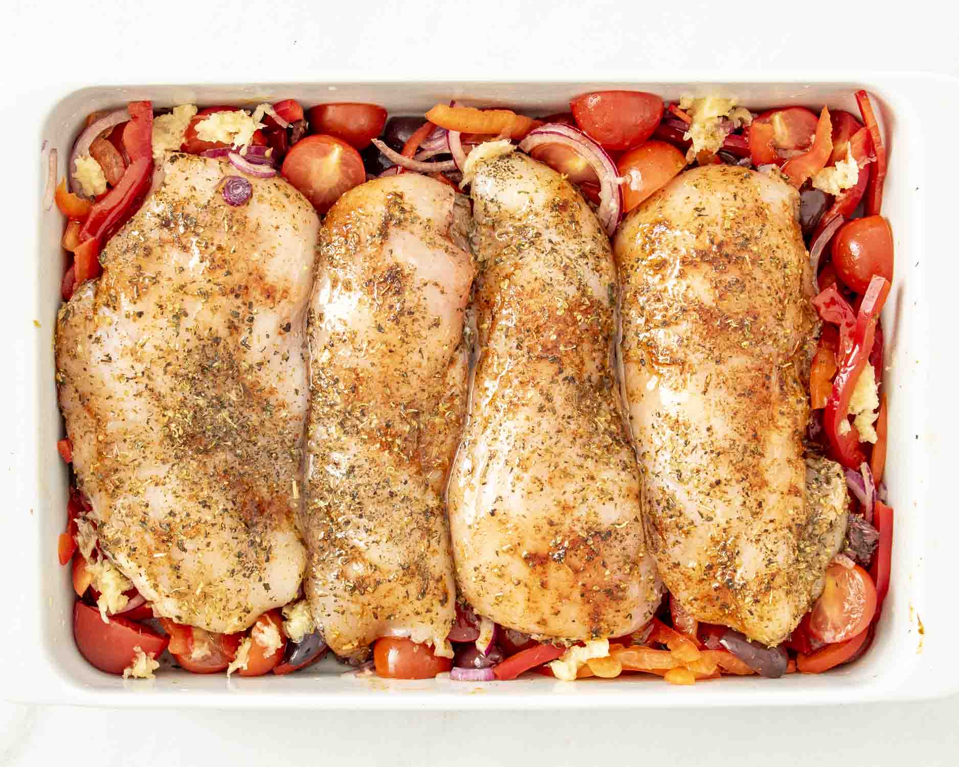 process shots showing how to make mediterranean chicken bake.