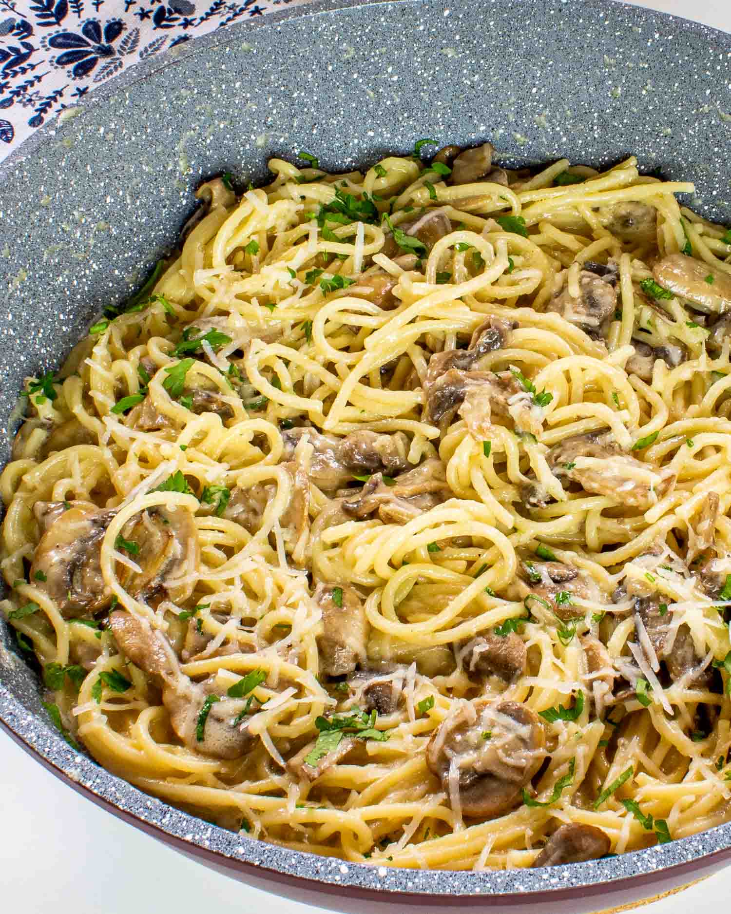 freshly made mushroom pasta in a skillet.