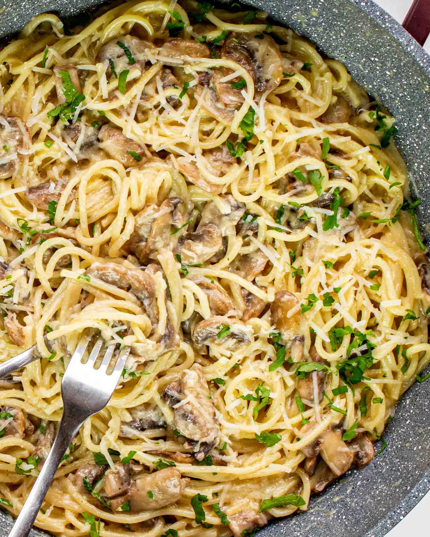 freshly made mushroom pasta in a skillet.