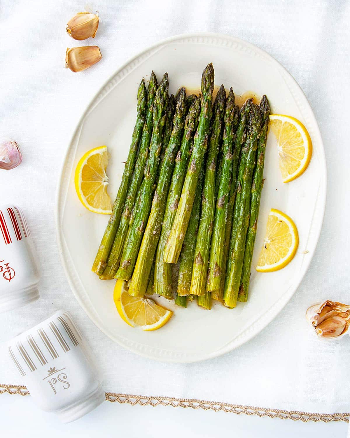 overhead of roasted asparagus on a serving platter.