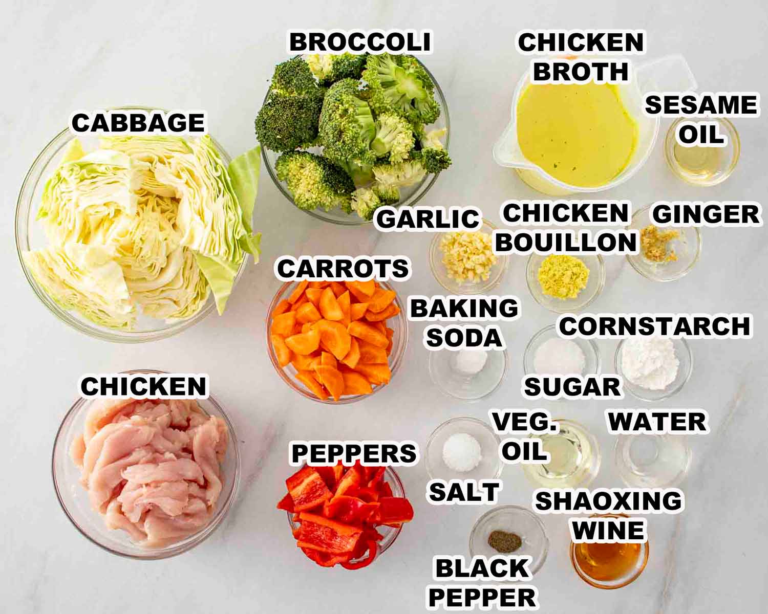 ingredients needed to make stir fried chicken and veggies in white sauce.