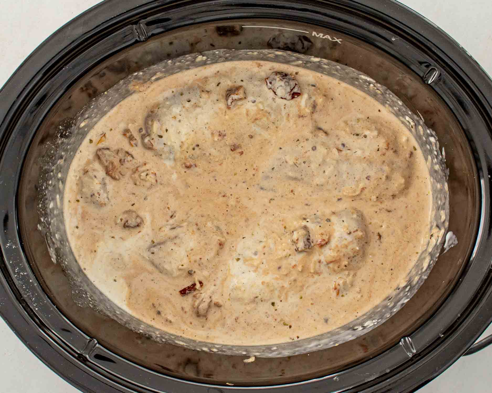 process shots showing how to make slow cooker marry me chicken.