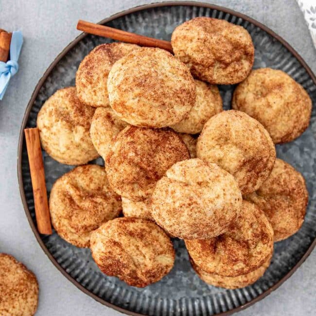 freshly baked snickerdoodle cookies on a metal plate.
