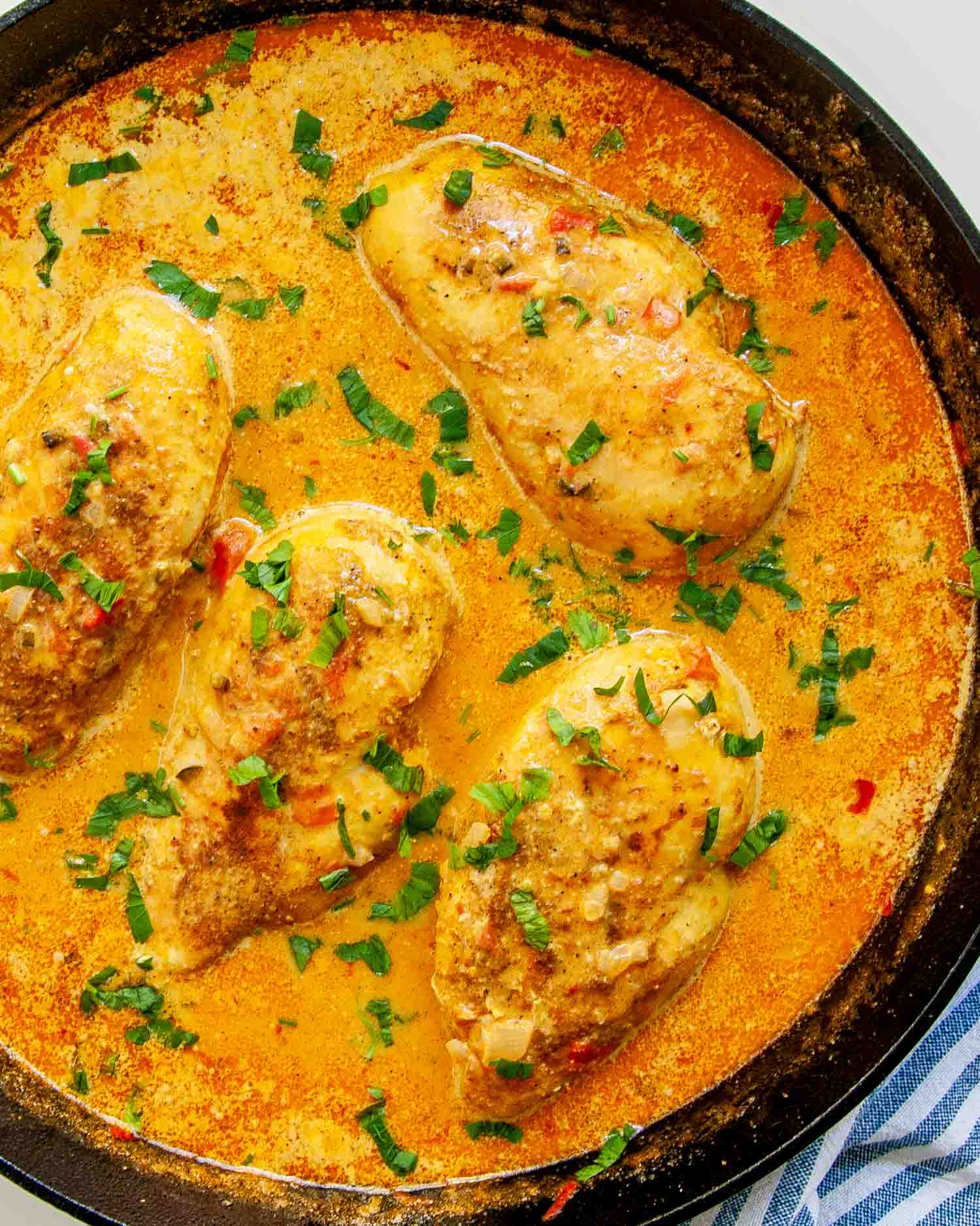 spicy brazilian coconut chicken in a skillet.
