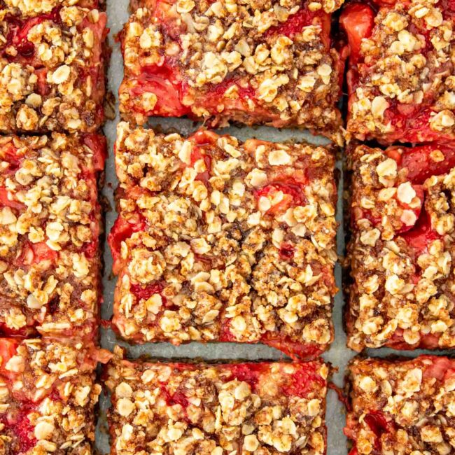 freshly baked strawberry oatmeal bars on a board.