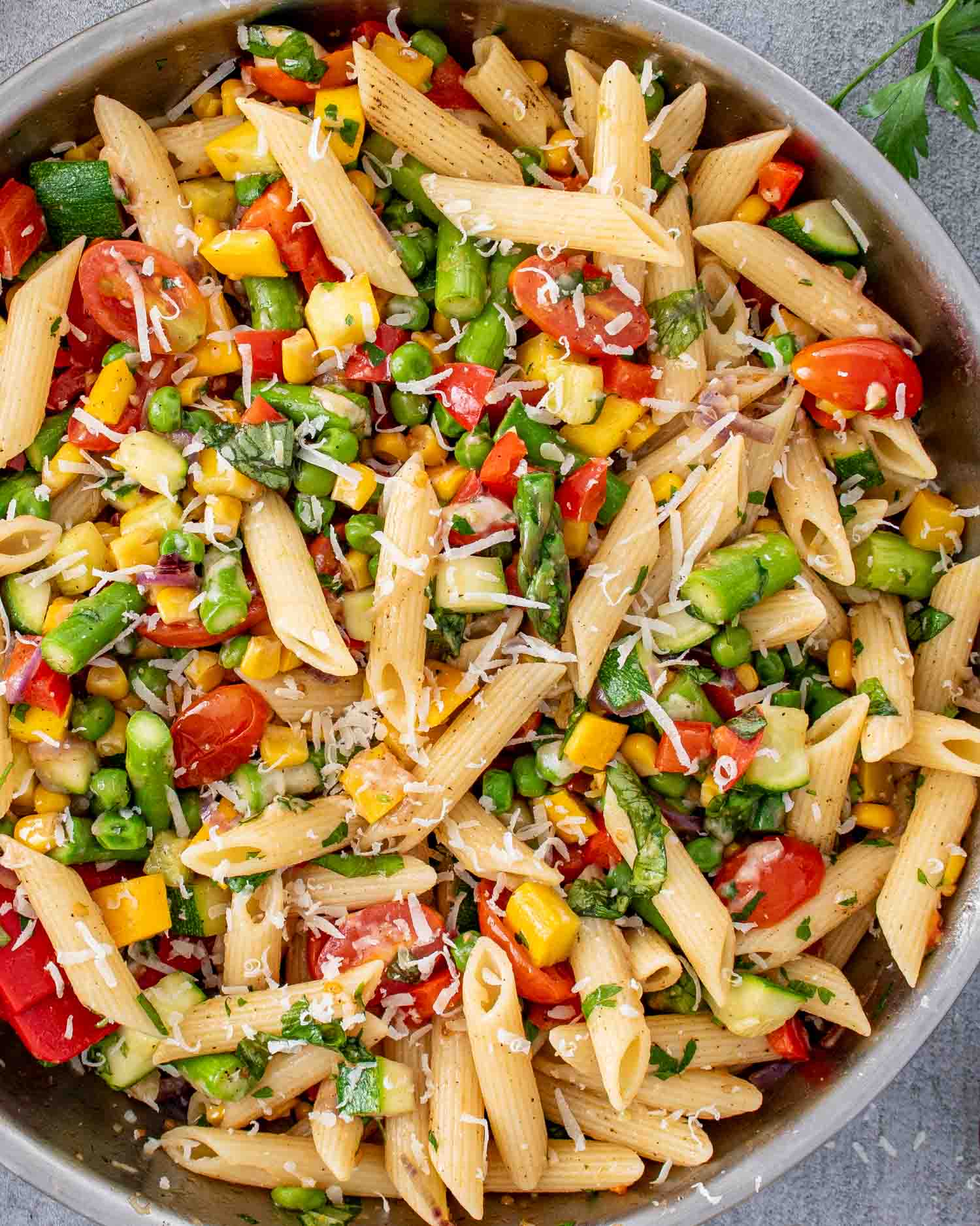 freshly made pasta primavera in a skillet.