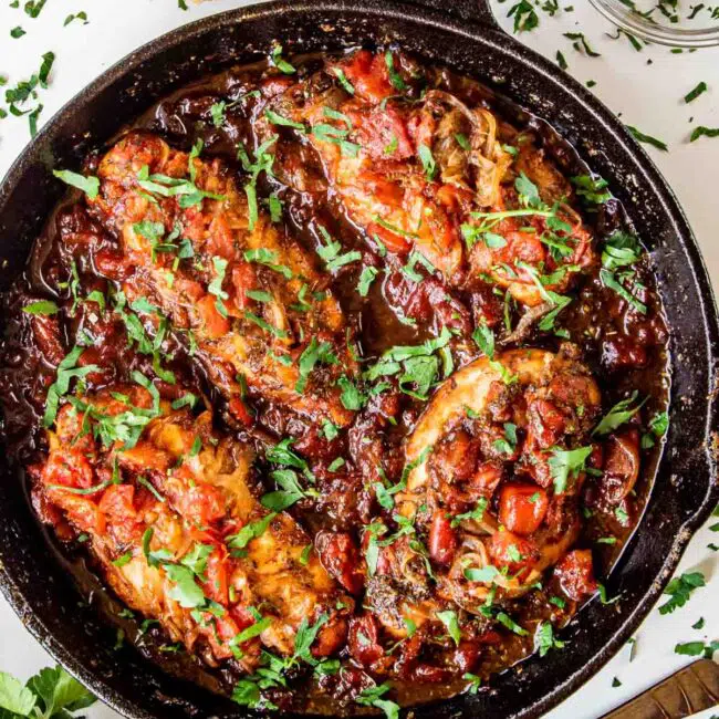 freshly made braised balsamic chicken in a skillet.