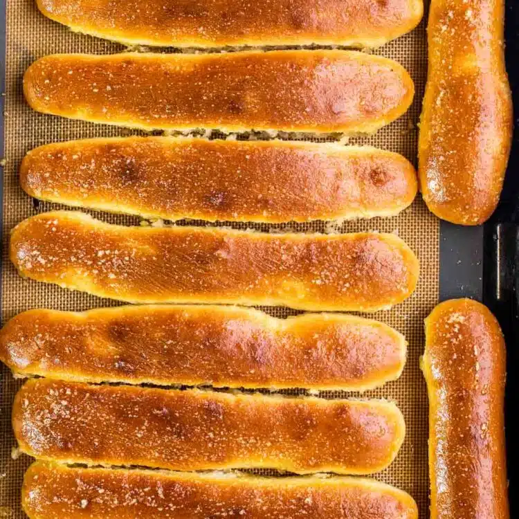 breadsticks on a baking sheet fresh from the oven.