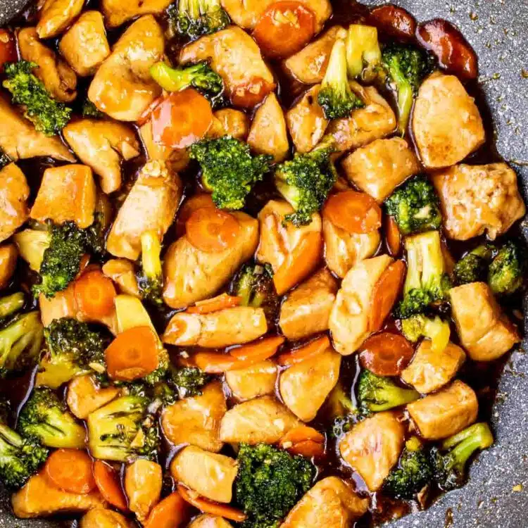 freshly made chicken stir fry in a skillet.