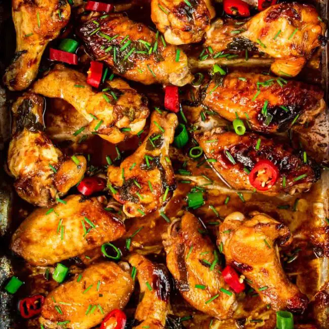 coca cola wings on a baking sheet fresh out of the oven.