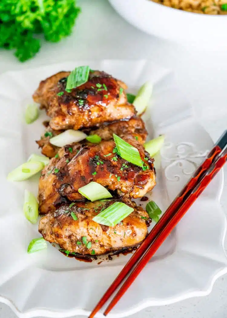 This Garlic Soy Chicken proves how a simple Asian inspired glaze can turn simple boring chicken thighs into delicious, super flavorful, tender chicken thighs that will be the star of your dinner. #garlicsoychicken #chicken #winnerwinnerchickendinner Garlic Soy Chicken