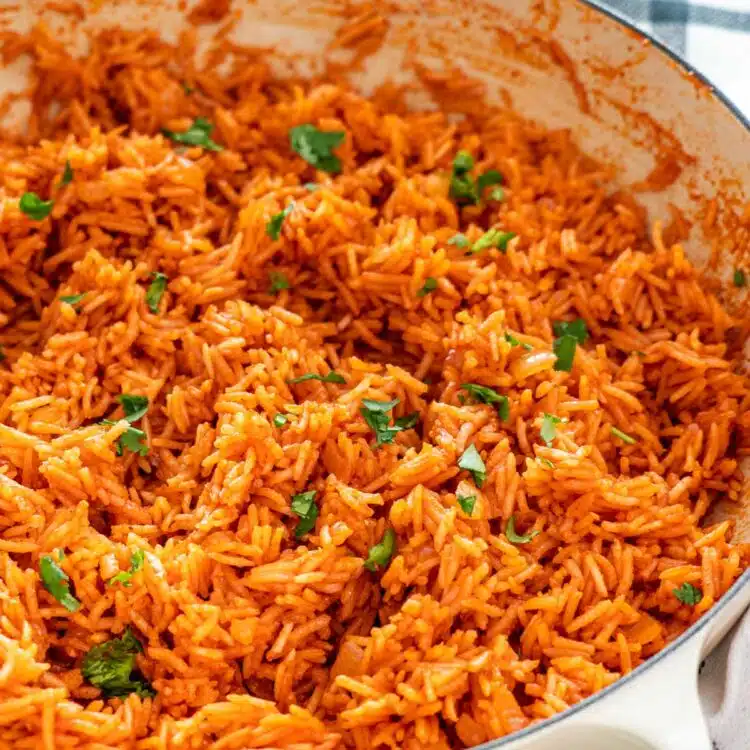 closeup shot of mexican rice in a dutch oven.