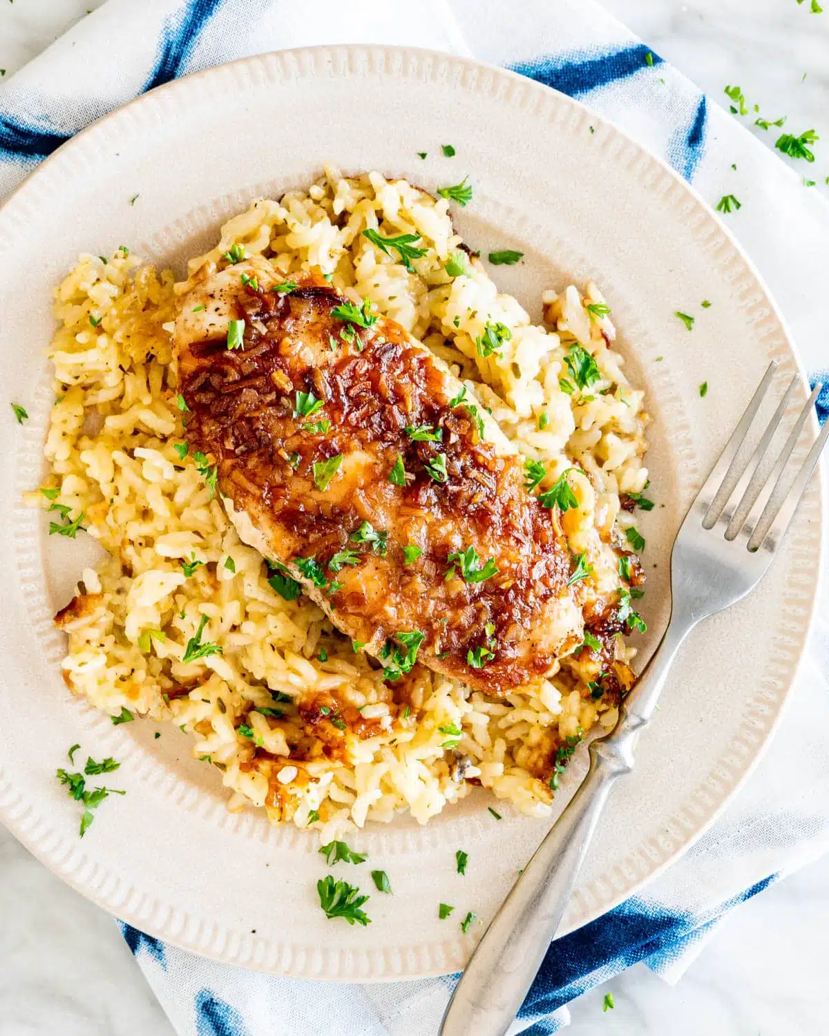 overhead shot of No Peek Chicken Rice Casserole in a white plate